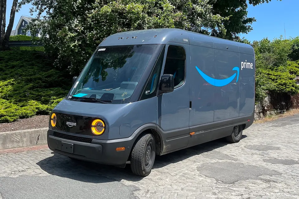 The front of a Rivian electric delivery van operated by Amazon